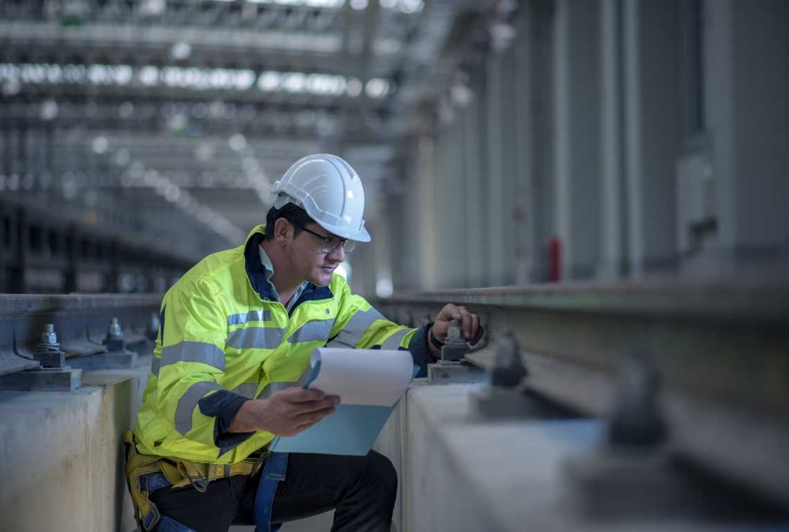 Man inspecting railway track